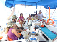 The crew ready for another full day of sailing with the autopilot doing the work